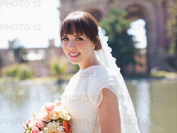 Portrait of young bride in park. Photo: Jessica Peterson