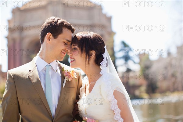 Portrait of young bride and groom. Photo : Jessica Peterson