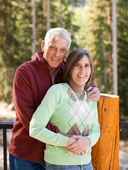 Portrait of smiling couple outdoors. Photo : Jessica Peterson