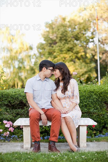 Couple sitting on bench in park. Photo: Jessica Peterson
