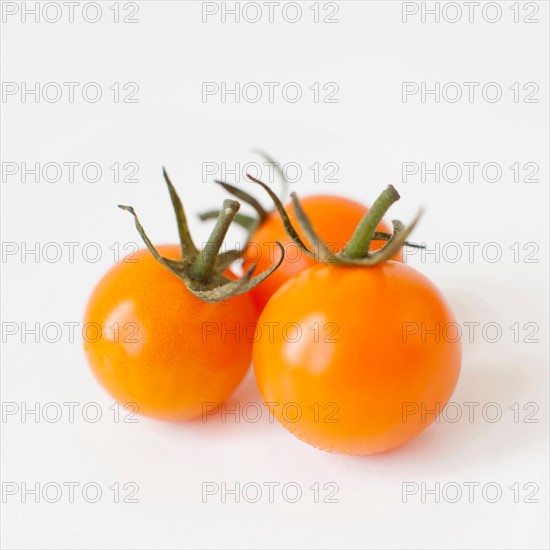 Studio Shot of three Cherry Tomatoes. Photo : Jessica Peterson