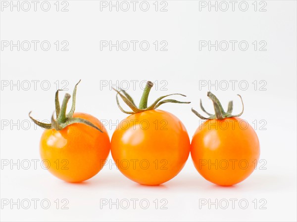 Studio Shot of three Cherry Tomatoes. Photo : Jessica Peterson