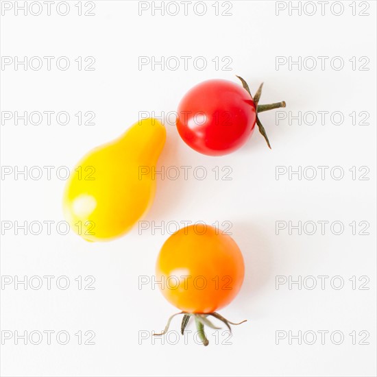 Studio Shot of three Cherry Tomatoes. Photo : Jessica Peterson