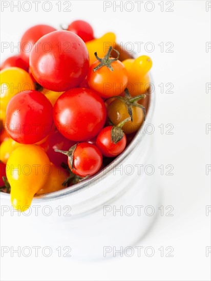 Studio Shot of Cherry Tomatoes in plastic container. Photo : Jessica Peterson