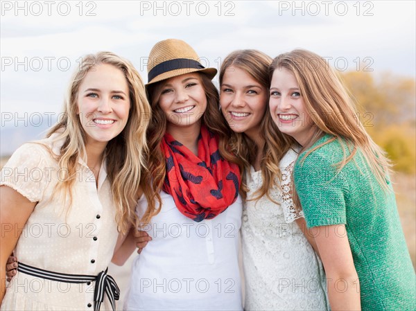 Waist up portrait of four friends. Photo : Jessica Peterson