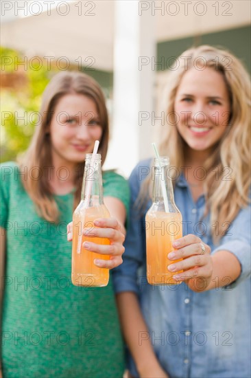 two young women with soda in focus. Photo: Jessica Peterson