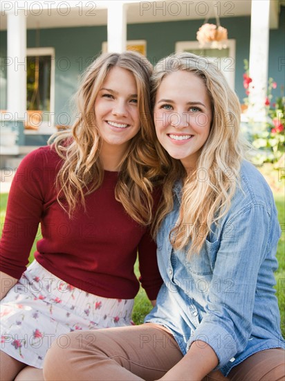 Portrait of two young women cheek to cheek. Photo: Jessica Peterson