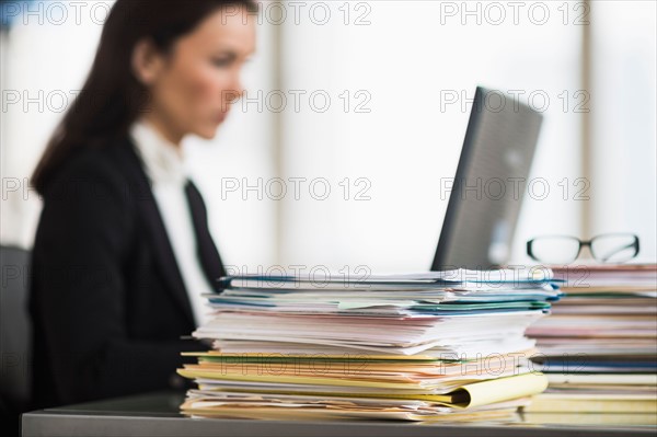 Businesswoman working in office.