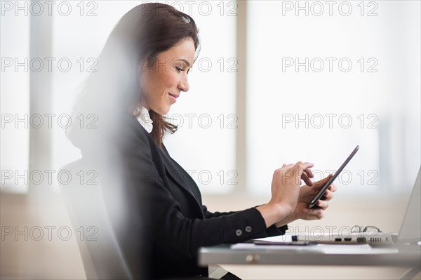Businesswoman using tablet pc.