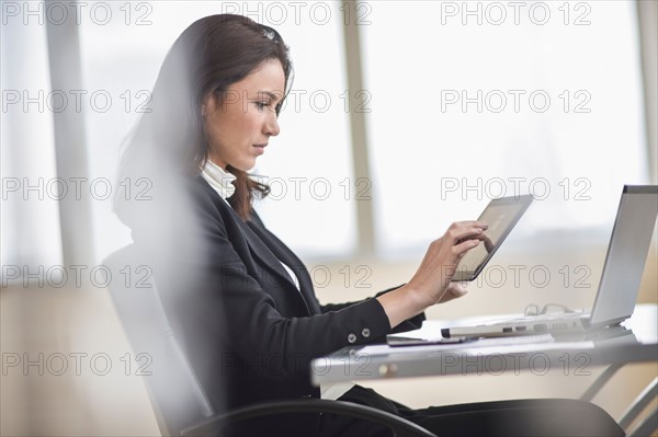 Businesswoman using tablet pc.