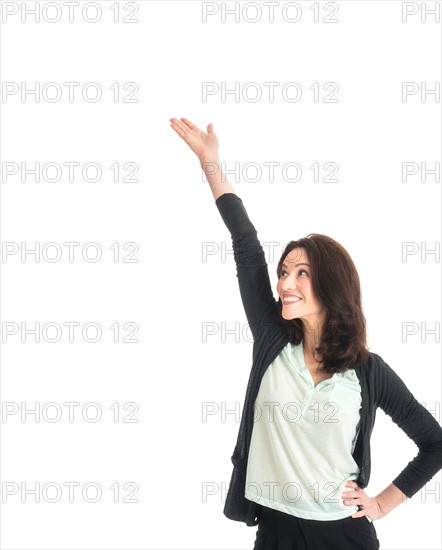 Studio portrait of mid adult woman.