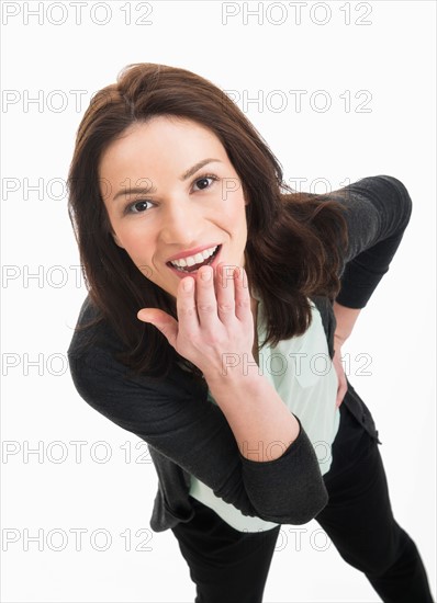 Studio portrait of mid adult woman.