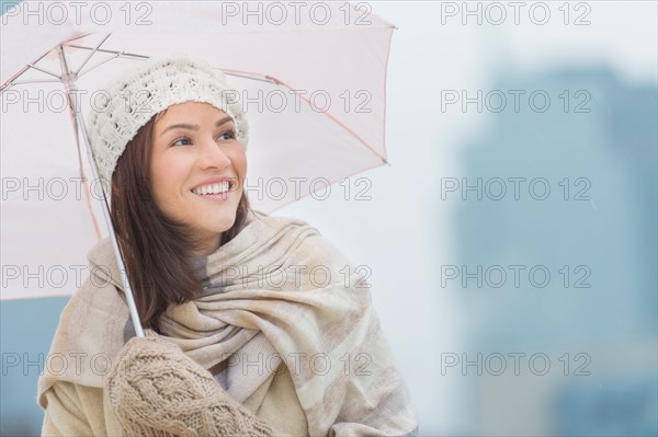 Portrait of woman with umbrella.