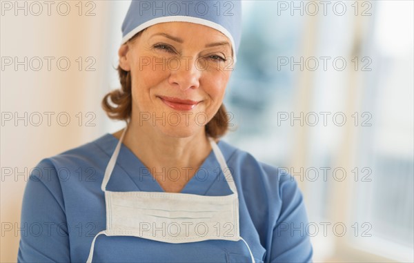 Portrait of smiling female surgeon.