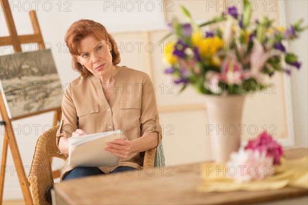 Woman sketching flowers.