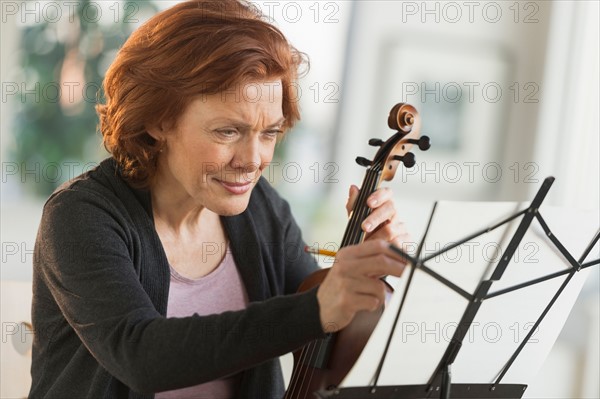 Senior woman composing music.