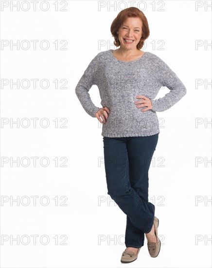 Studio shot of senior woman smiling.