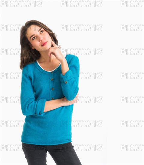 Studio shot of pensive young woman.