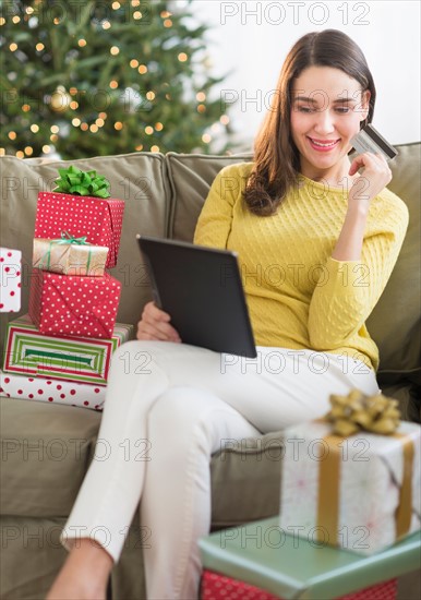 Woman buying christmas gift via internet.