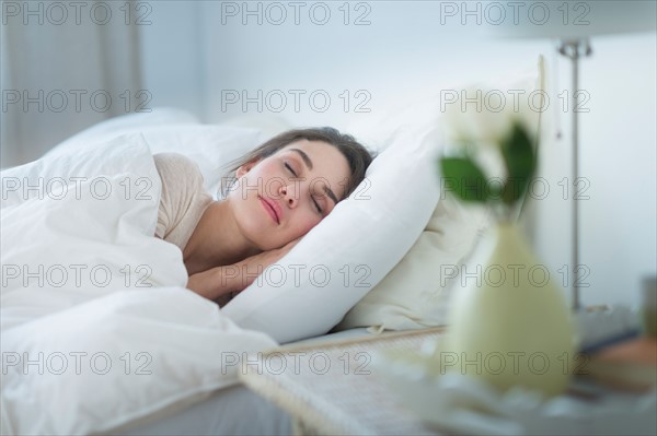 Woman sleeping in bed.