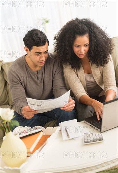 Couple doing home finances.