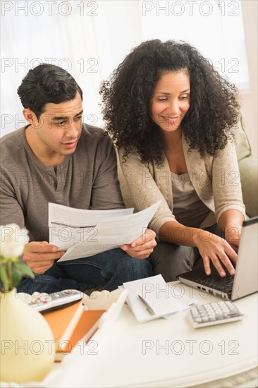 Couple doing home finances.