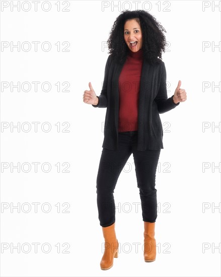 Portrait of mid adult woman gesturing, studio shot.