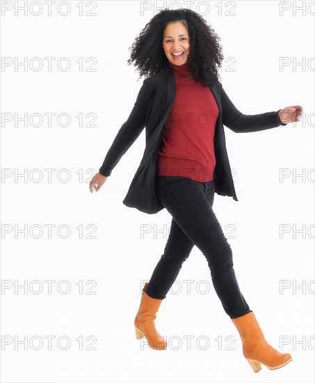 Studio portrait of mid adult woman.