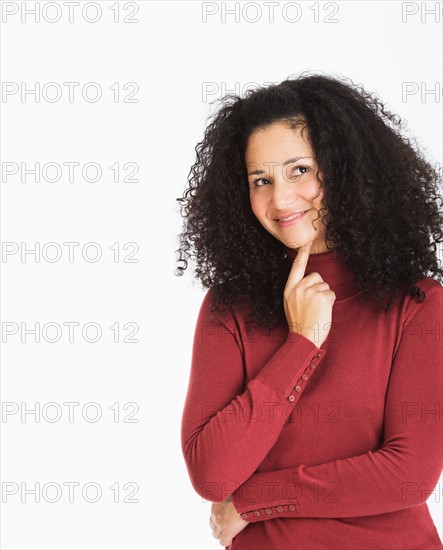 Studio portrait of mid adult woman.