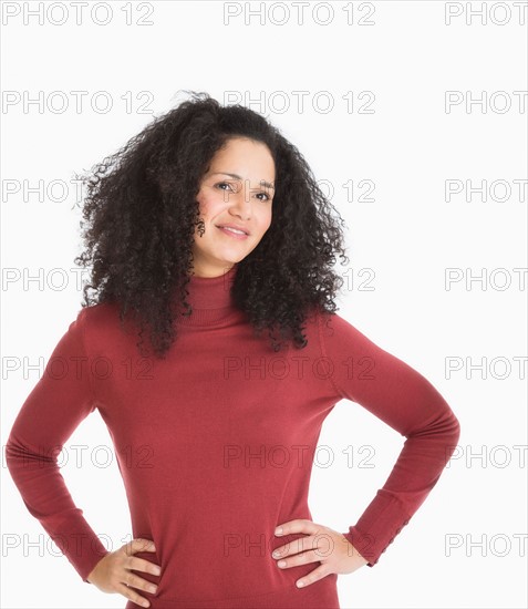 Studio portrait of mid adult woman.