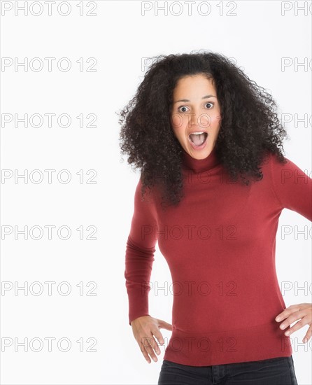 Studio portrait of mid adult woman.