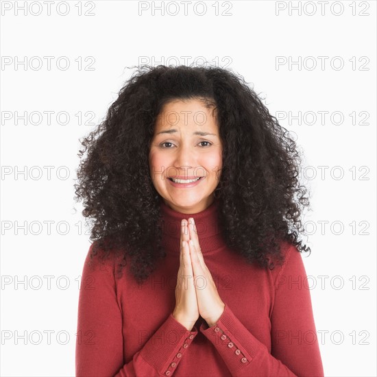 Studio portrait of mid adult woman.