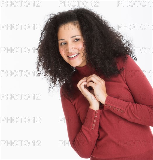 Studio portrait of mid adult woman.