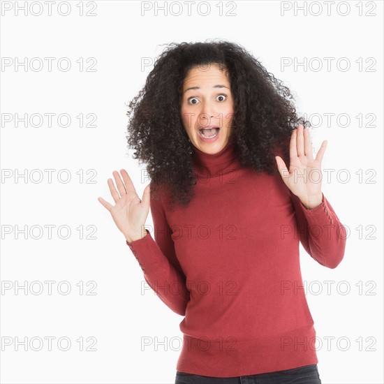 Studio portrait of mid adult woman.