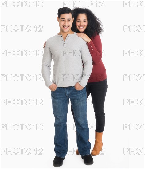 Studio portrait of young couple.