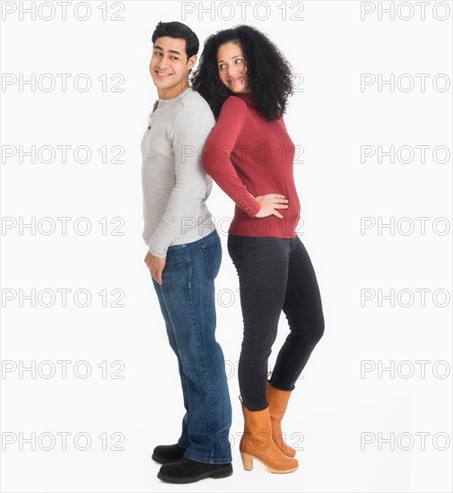 Studio portrait of young couple.