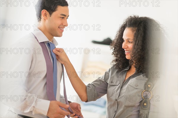 Couple buying tie.