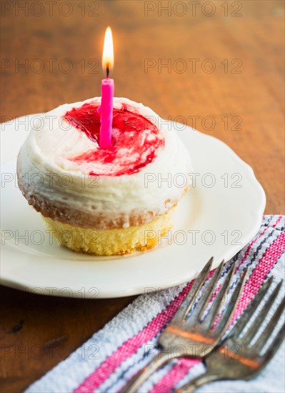 Cupcake with candle.