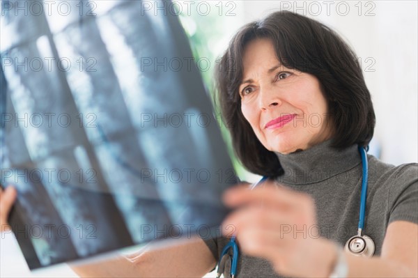 Doctor looking at x-ray image.