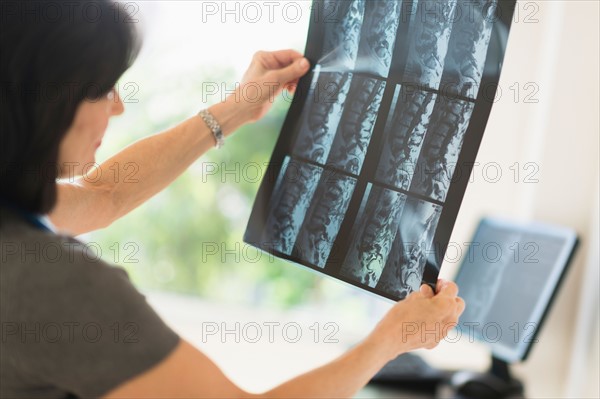 Doctor looking at x-ray image.