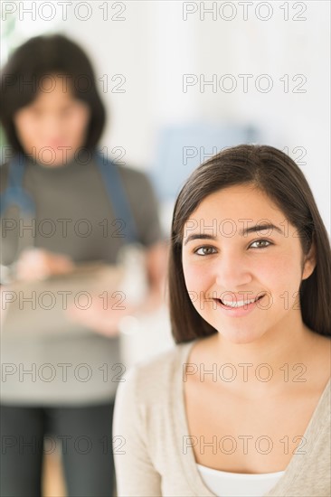 Teenage girl (16-17) in doctor's office.