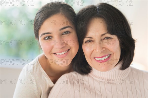 Portrait of grandmother and granddaughter (16-17).