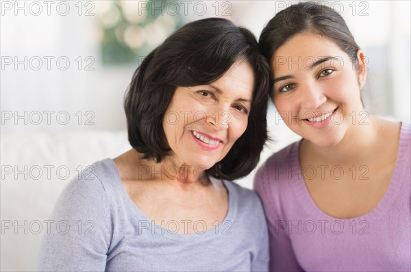 Portrait of grandmother and granddaughter (16-17).
