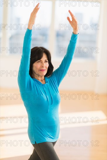 Portrait of senior woman exercising.