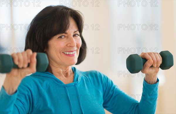 Portrait of senior woman exercising.