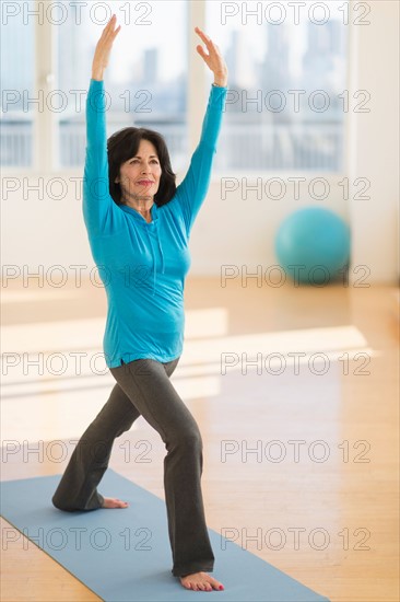 Portrait of senior woman exercising.