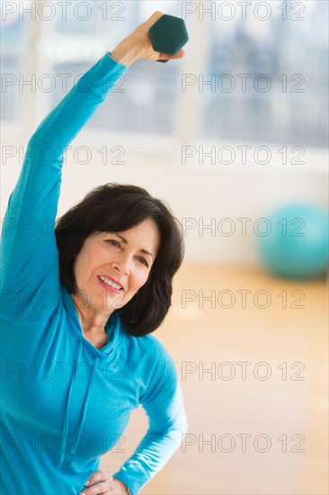 Portrait of senior woman exercising.