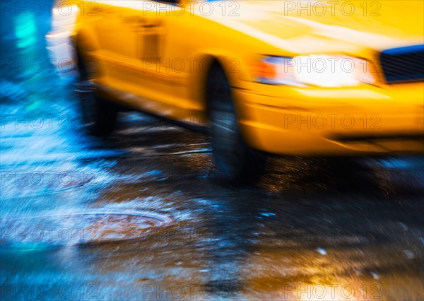 Yellow cab in blurred motion.