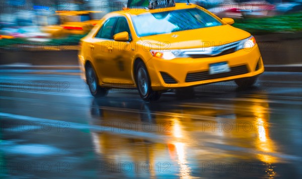 Yellow cab in blurred motion.