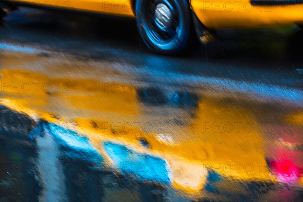 Yellow cab in blurred motion.